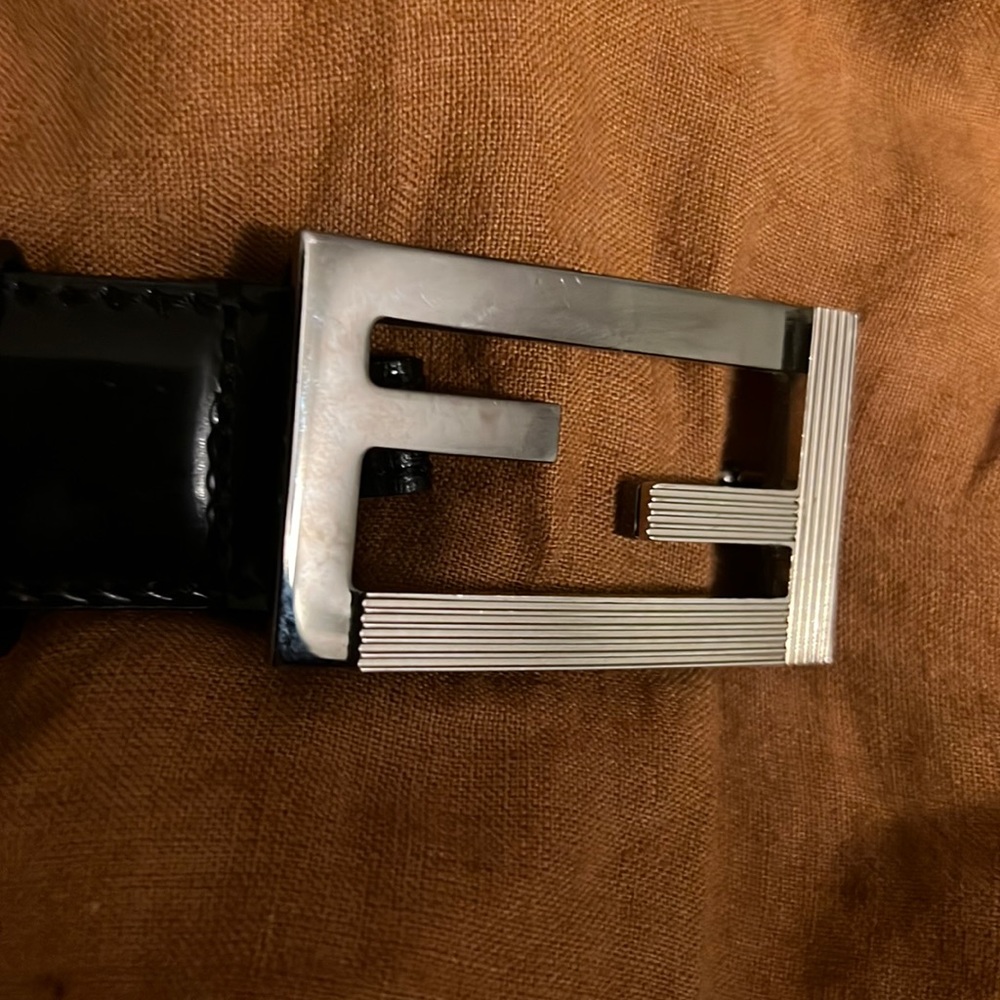 Slightly worn Fendi dress belt size 34. Glossy/shiny belt